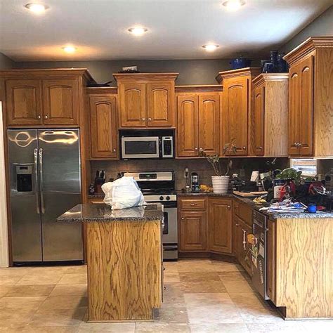 stainless steel vs black stainless with honey oak cabinets|honey oak cabinet finish.